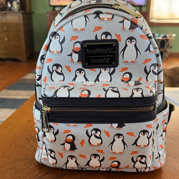 Loungefly Handbags - SeaWorld exclusive penguin AOP Hard Tag Loungefly NWT